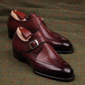 Red monk's shoes